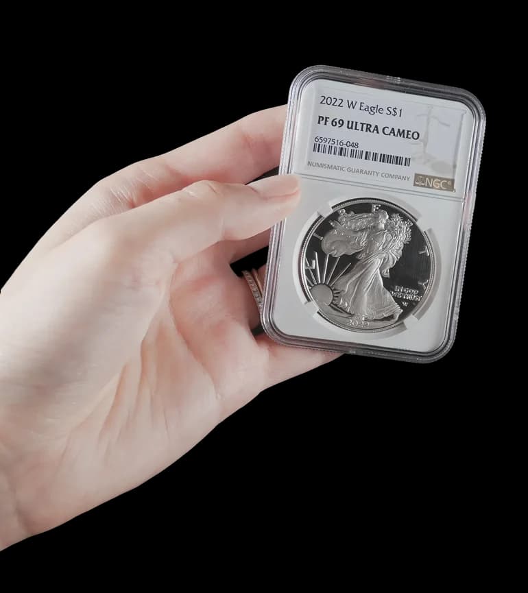 Hand holding coin